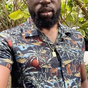 MBX Premium Goods floral resort wear button down shirt.